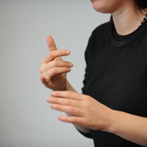 Woman signing in sign language 