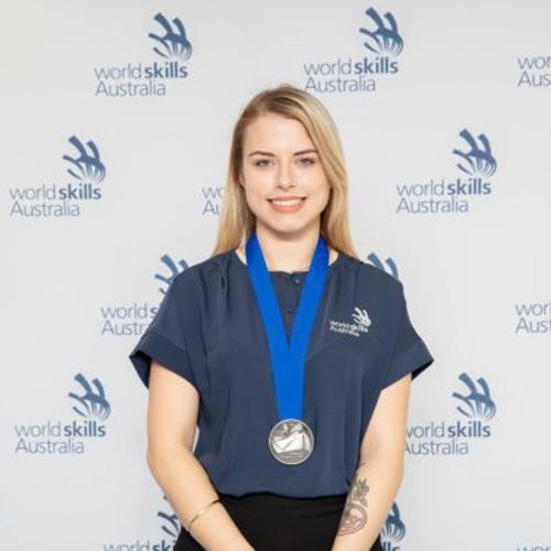 2018 student Leah Straughair with silver medal around neck at Worldskills Australia awards event