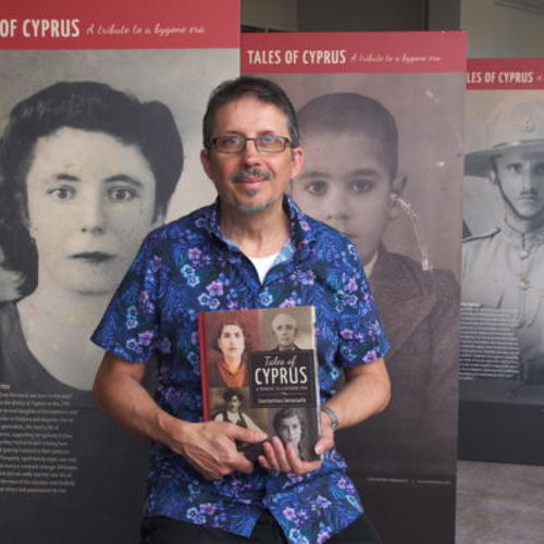 Con Emmanuelle standing with his book
