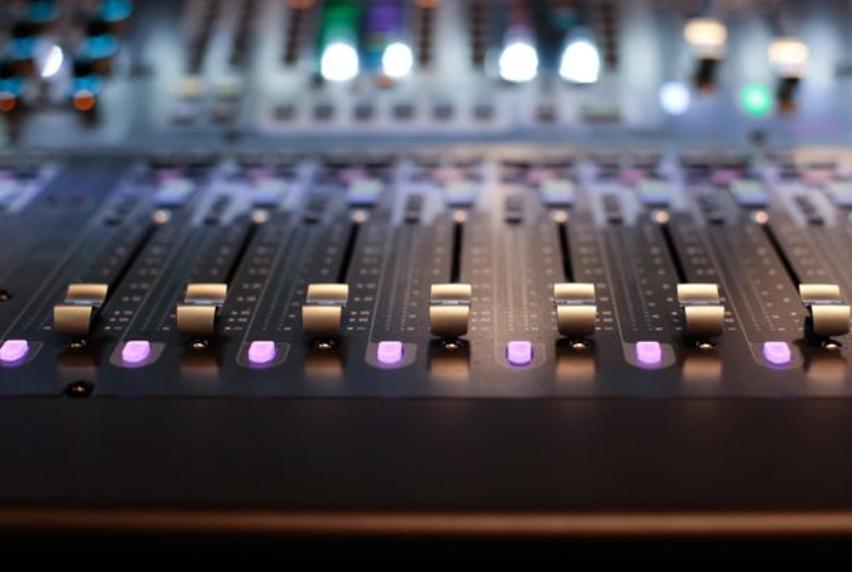 Close-up of audio mixing desk