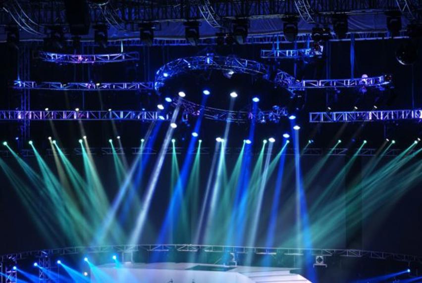 Image of empty stage lit up with blue lights