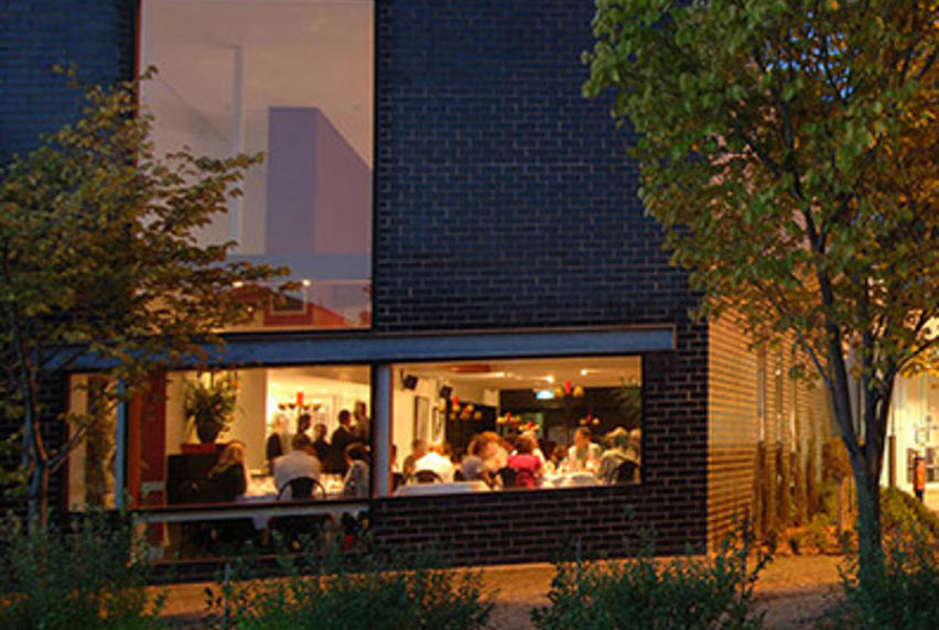 twilight image looking into windows of St. George's Restaurant
