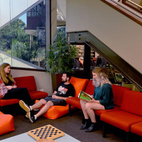 Students sitting on couches in Fairfield campus foyer